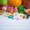 Multivitamin,Supplements,From,Fruit,On,White,Wooden,Background.